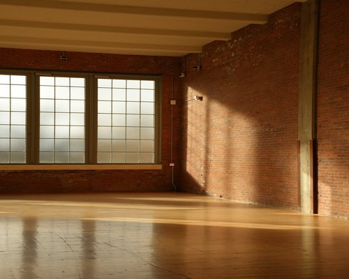 Empty studio room with hardwood floors